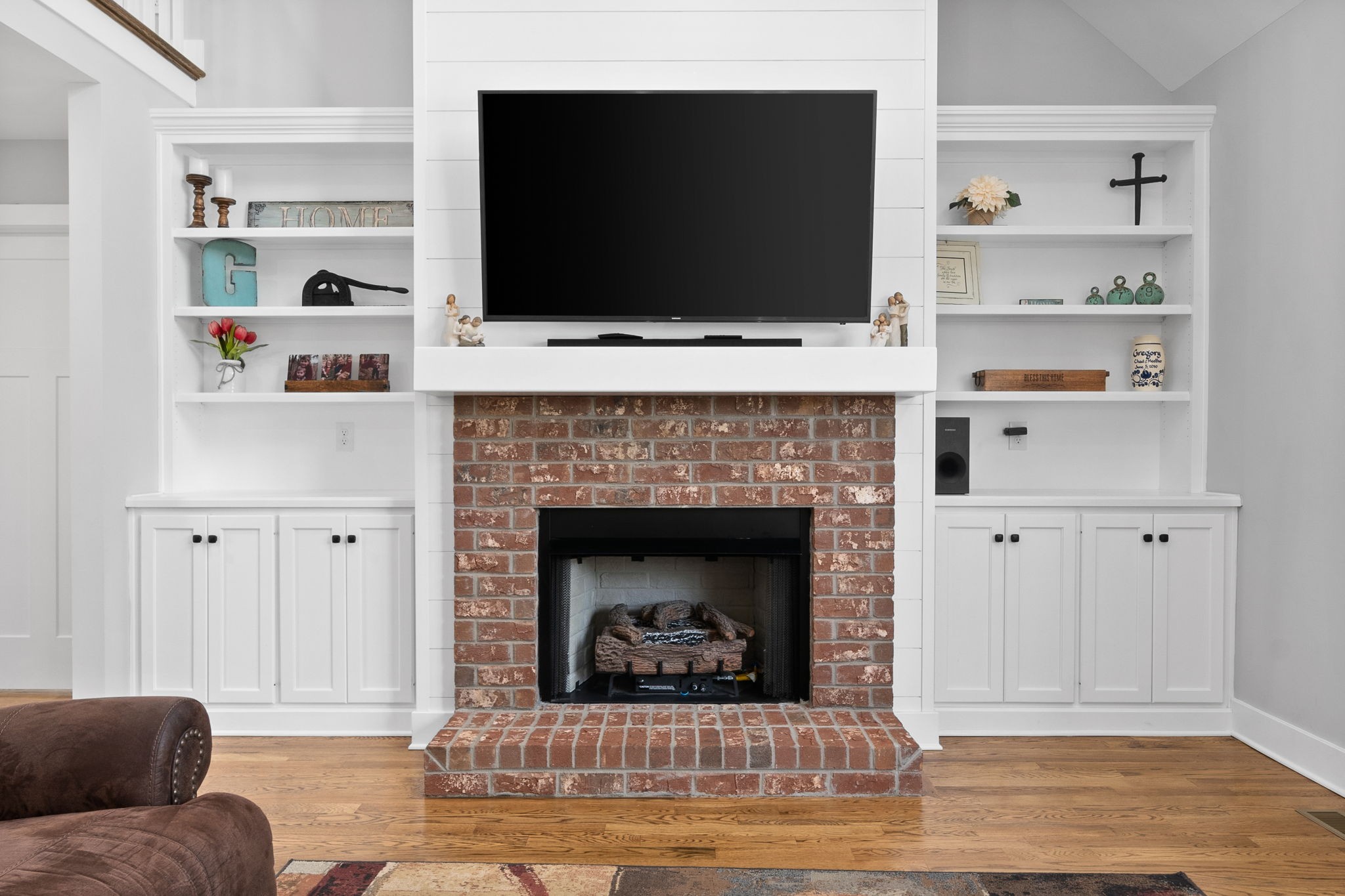 3744 McGregor Road Adams, TN 37010 - Photo 7 of 48 a living room with a fireplace and a flat screen tv