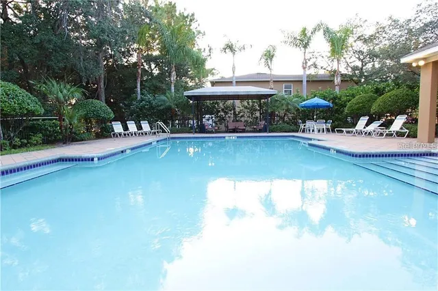 a view of a chair and table in the patio