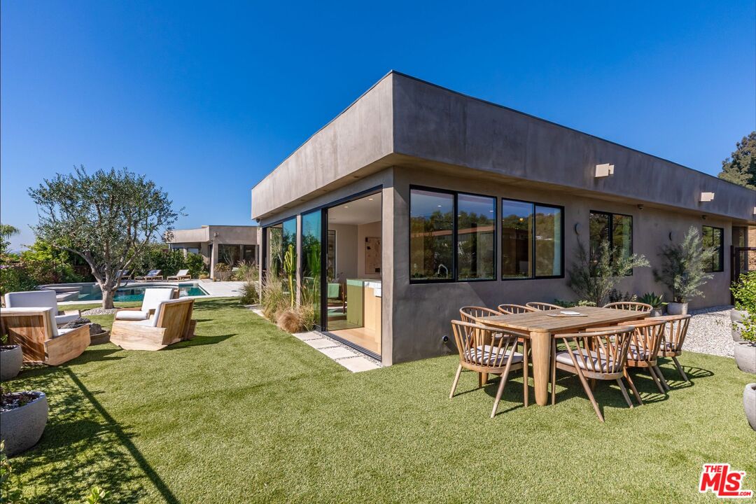 1705 Carla Ridge Beverly Hills, CA 90210 - Photo 30 of 39 a view of a house with backyard and sitting area