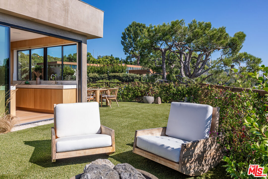 1705 Carla Ridge Beverly Hills, CA 90210 - Photo 31 of 39 a outdoor living space with furniture and a garden