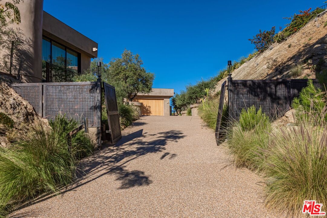 1705 Carla Ridge Beverly Hills, CA 90210 - Photo 38 of 39 a view of a house with a yard
