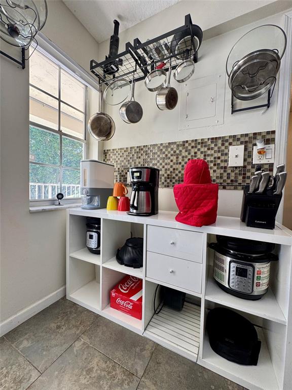 2601 South Course Drive, Unit 305 Pompano Beach, FL 33069 - Photo 3 of 20 a kitchen with a stove a microwave and window