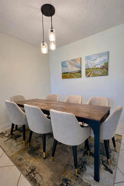 2601 South Course Drive, Unit 305 Pompano Beach, FL 33069 - Photo 6 of 20 a view of a dining room with furniture and wooden floor