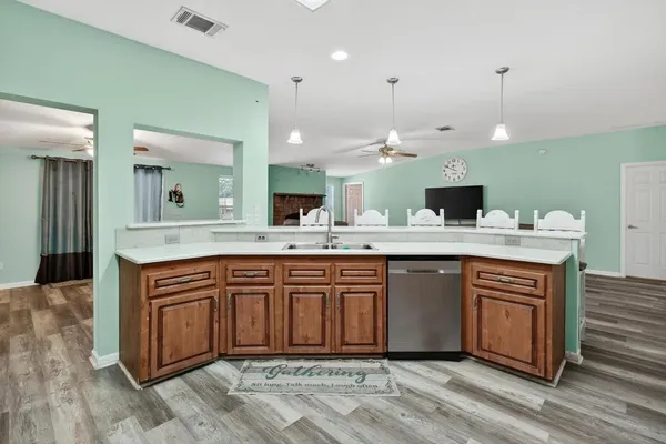 a spacious bathroom with a granite countertop sink and a mirror