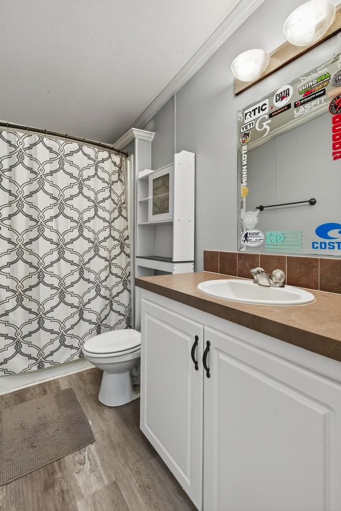 85614 Wilson Neck Road Yulee, FL 32097 - Photo 32 of 48 a bathroom with a sink a toilet and a mirror