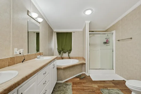 a bathroom with a double vanity sink and a mirror