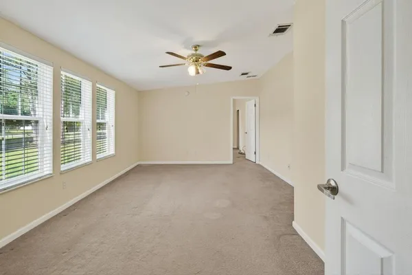 a view of an empty room with a window