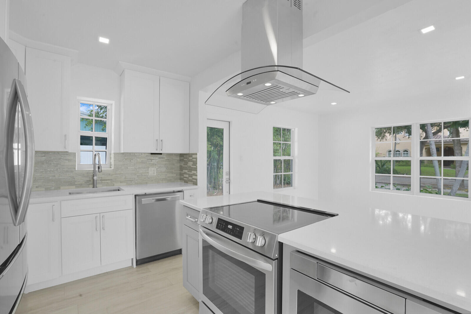 826 Sunset Road West Palm Beach, FL 33401 - Photo 11 of 52 a kitchen with a sink and stove