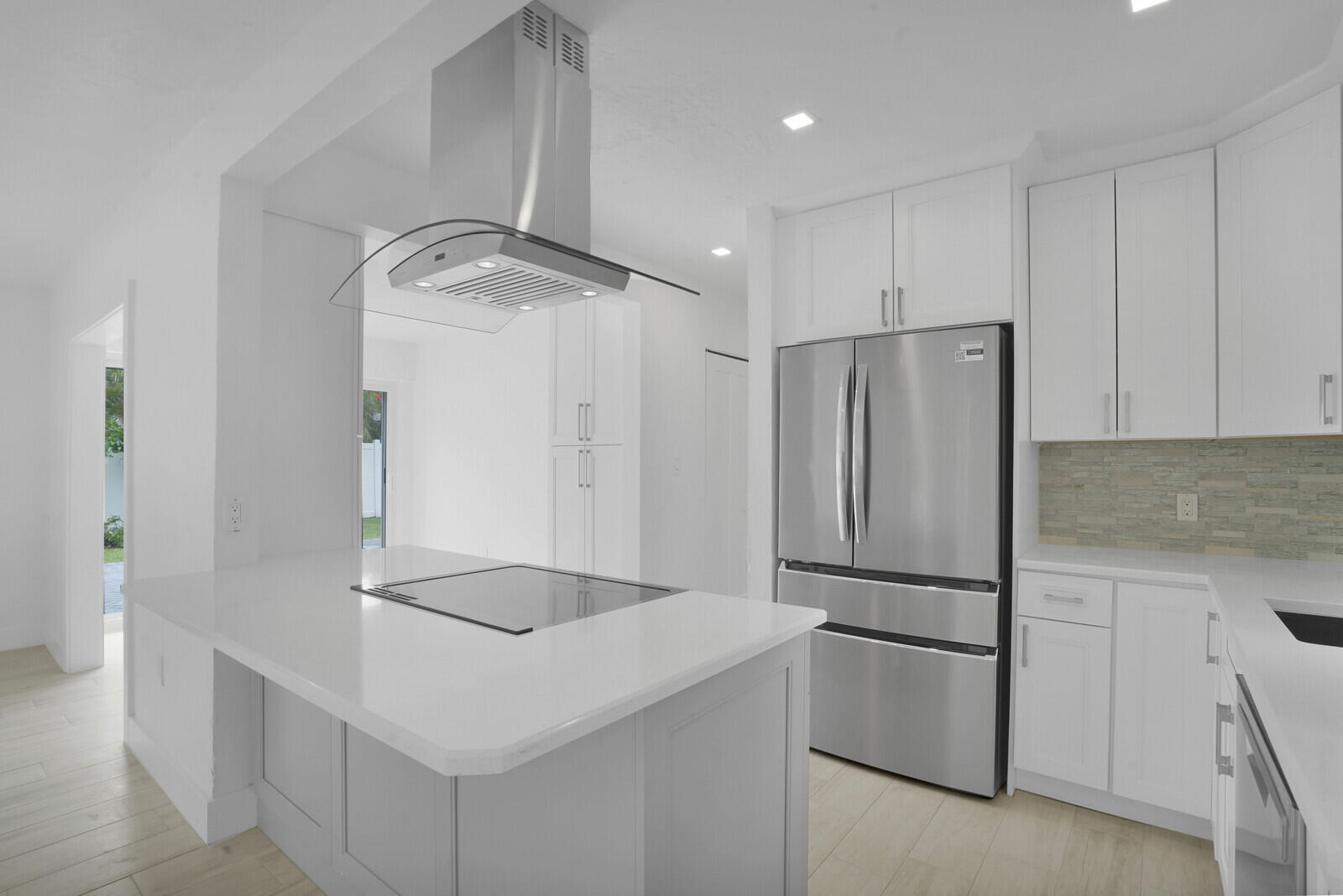 826 Sunset Road West Palm Beach, FL 33401 - Photo 10 of 52 a kitchen with granite countertop a refrigerator and a sink