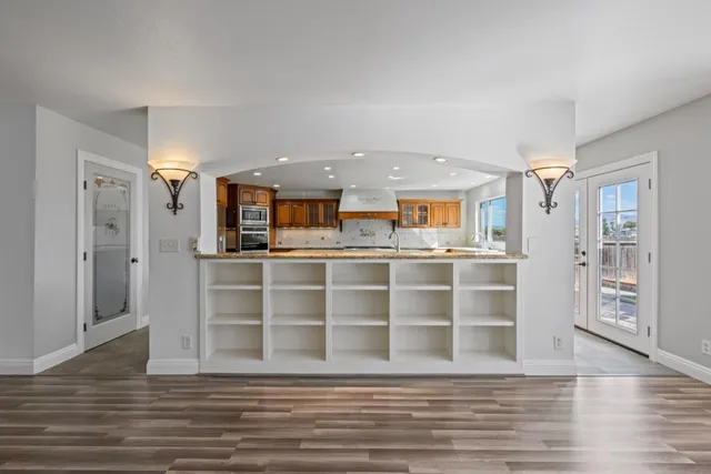 a kitchen with stainless steel appliances granite countertop a stove and a sink