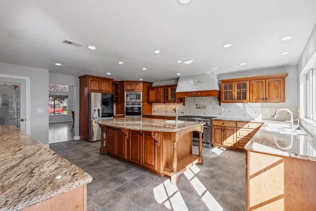 a kitchen with a sink and a window