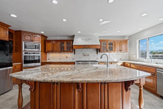 a bathroom with a sink and cabinets