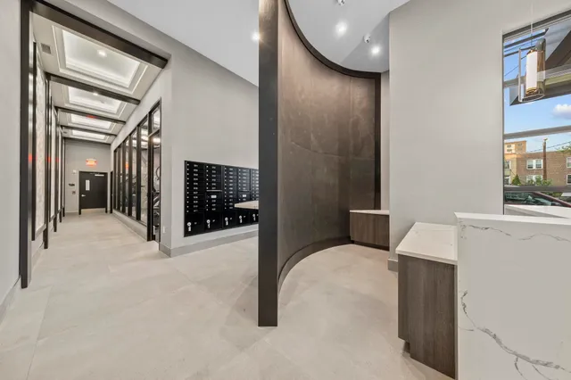 a view of hallway with livingroom and furniture