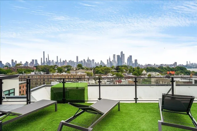 a terrace with a table and chairs