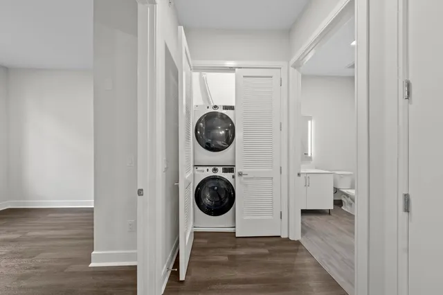 a view of a hallway with washer and dryer