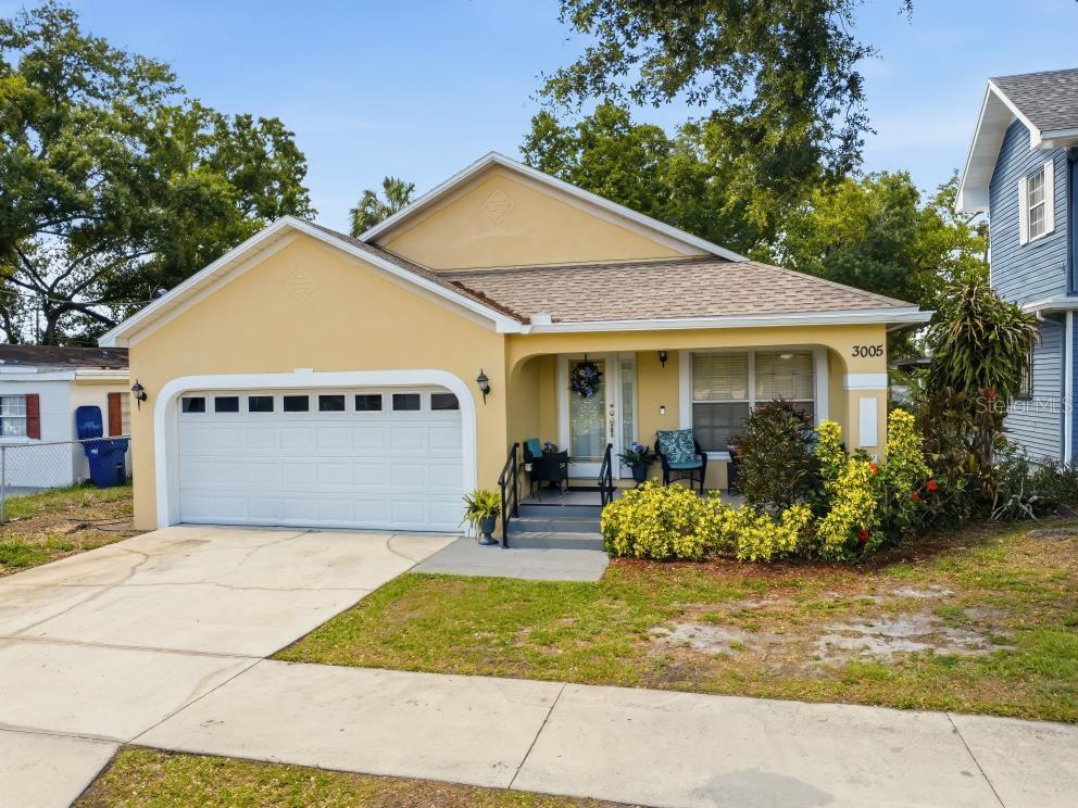 3005 West Chestnut Street Tampa, FL 33607 - Photo 2 of 27 a front view of a house with garden