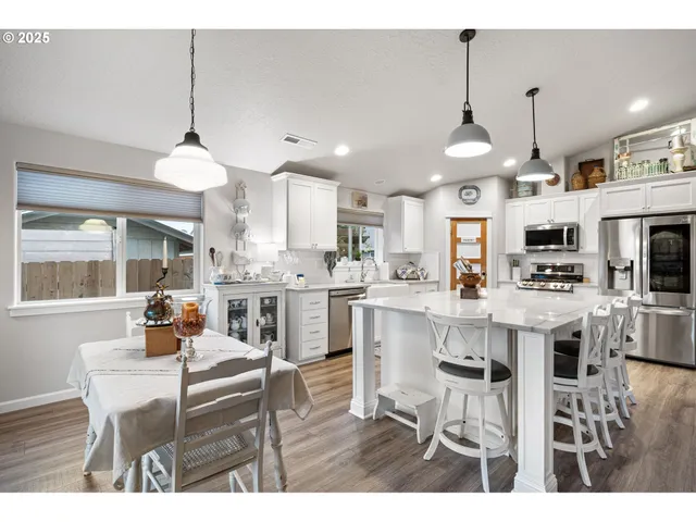 a kitchen and a dining table in a kitchen