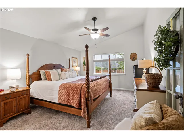 a bed room with a bed and a chandelier