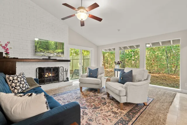 a living room with furniture and a fireplace