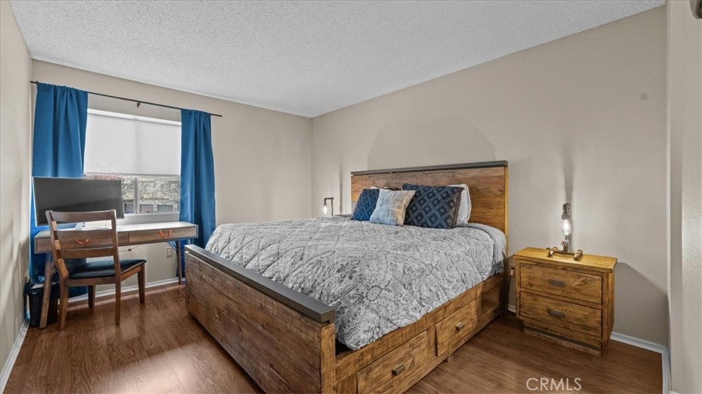 8425 Sunset Trail Place, Unit F Rancho Cucamonga, CA 91730 - Photo 10 of 28 a bedroom with a bed and a table