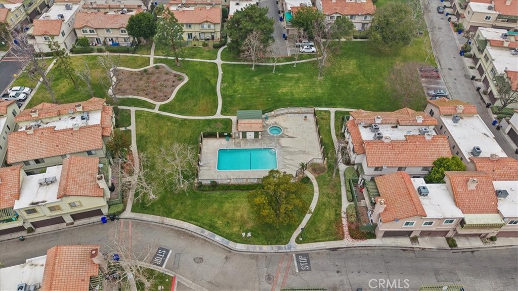 8425 Sunset Trail Place, Unit F Rancho Cucamonga, CA 91730 - Photo 17 of 28 an aerial view of a house with a garden and lake view