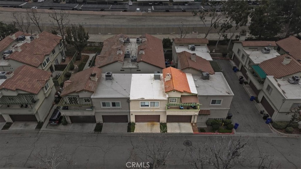 8425 Sunset Trail Place, Unit F Rancho Cucamonga, CA 91730 - Photo 20 of 28 an aerial view of a house with parking