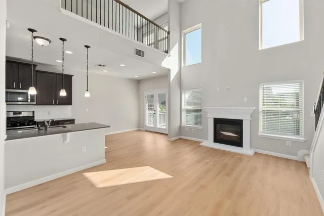 a large kitchen with cabinets a sink and a stove