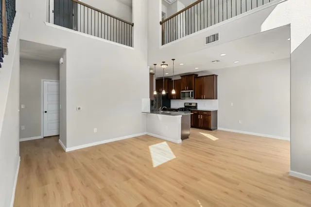 a view of kitchen with microwave and cabinets