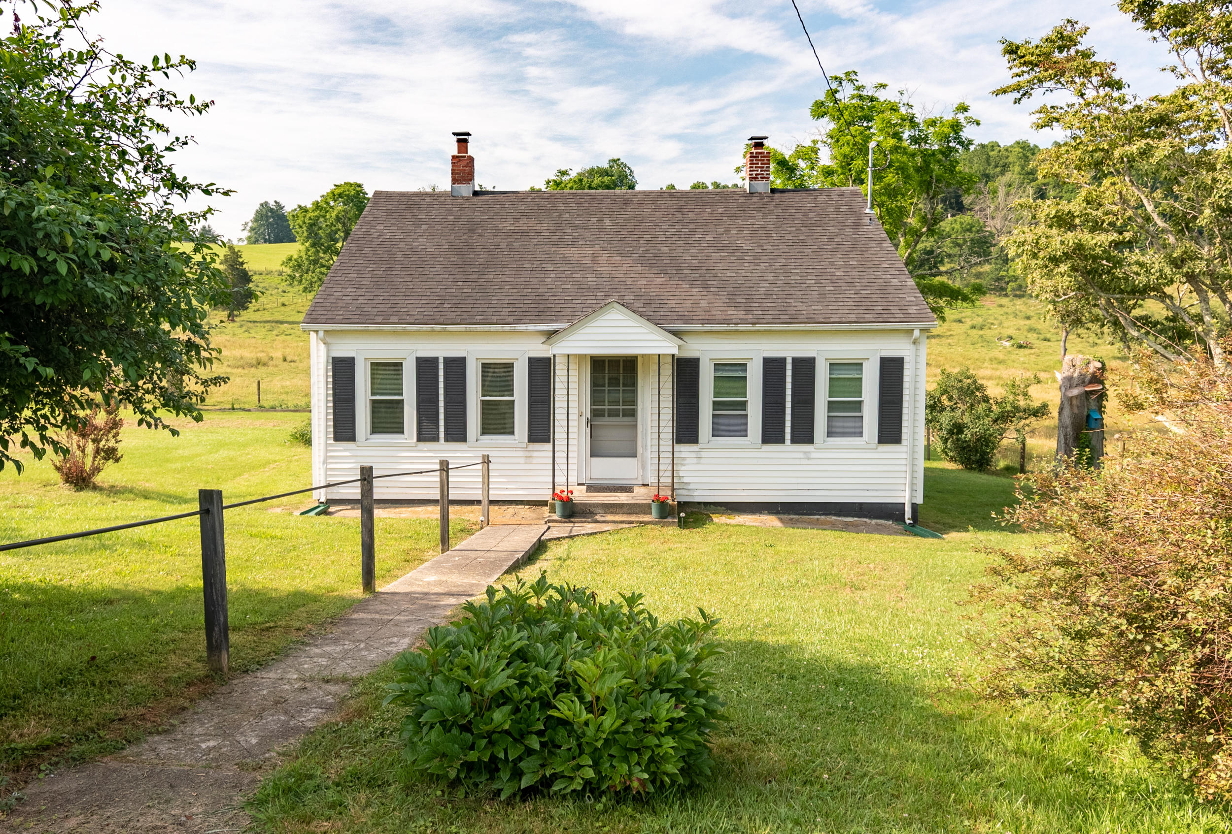 856 Conner Grove Road Southwest Willis, VA 24380 - Photo 1 of 63 a view of a house with pool and chairs