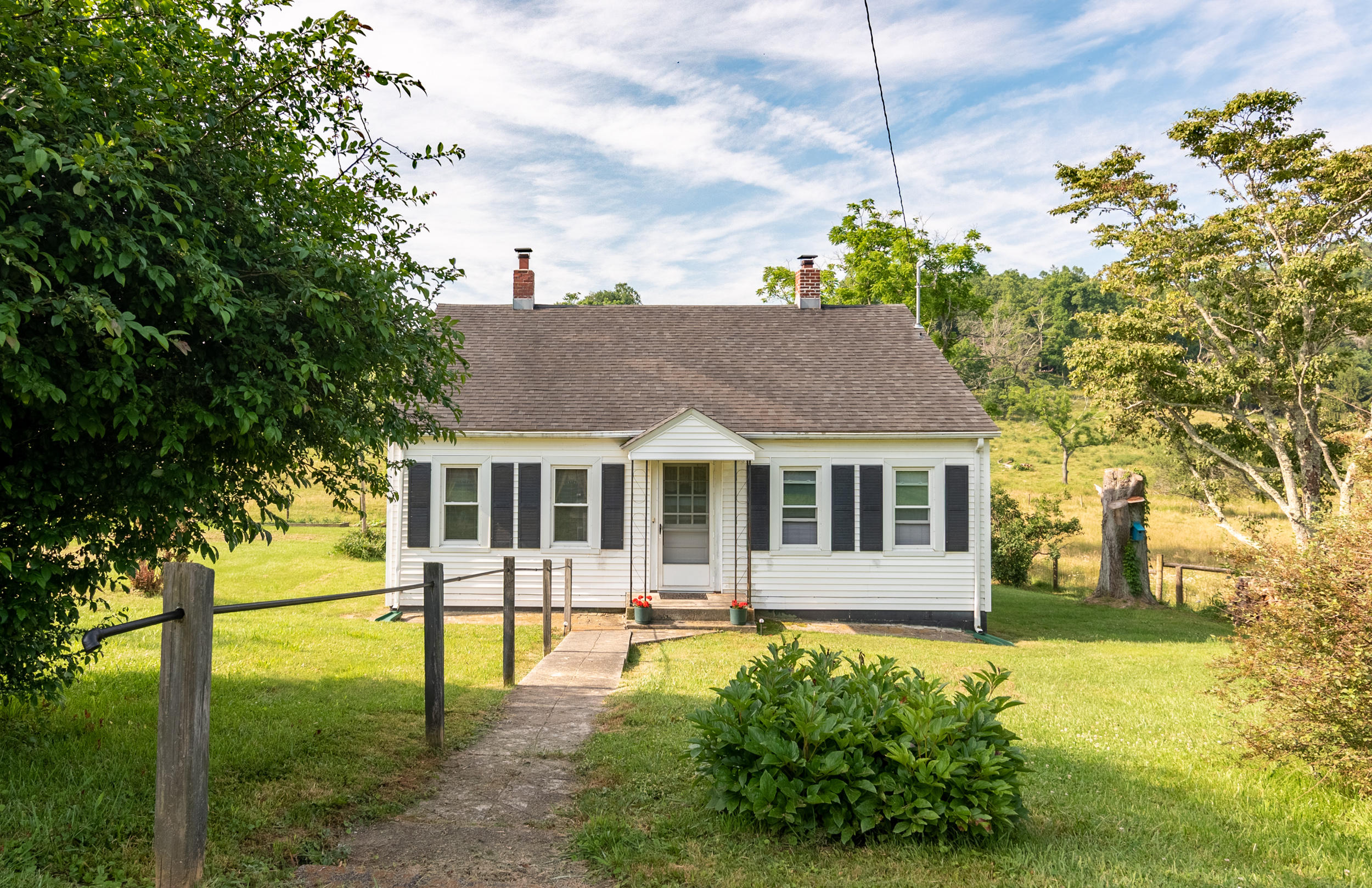 856 Conner Grove Road Southwest Willis, VA 24380 - Photo 2 of 63 a front view of a house with a yard