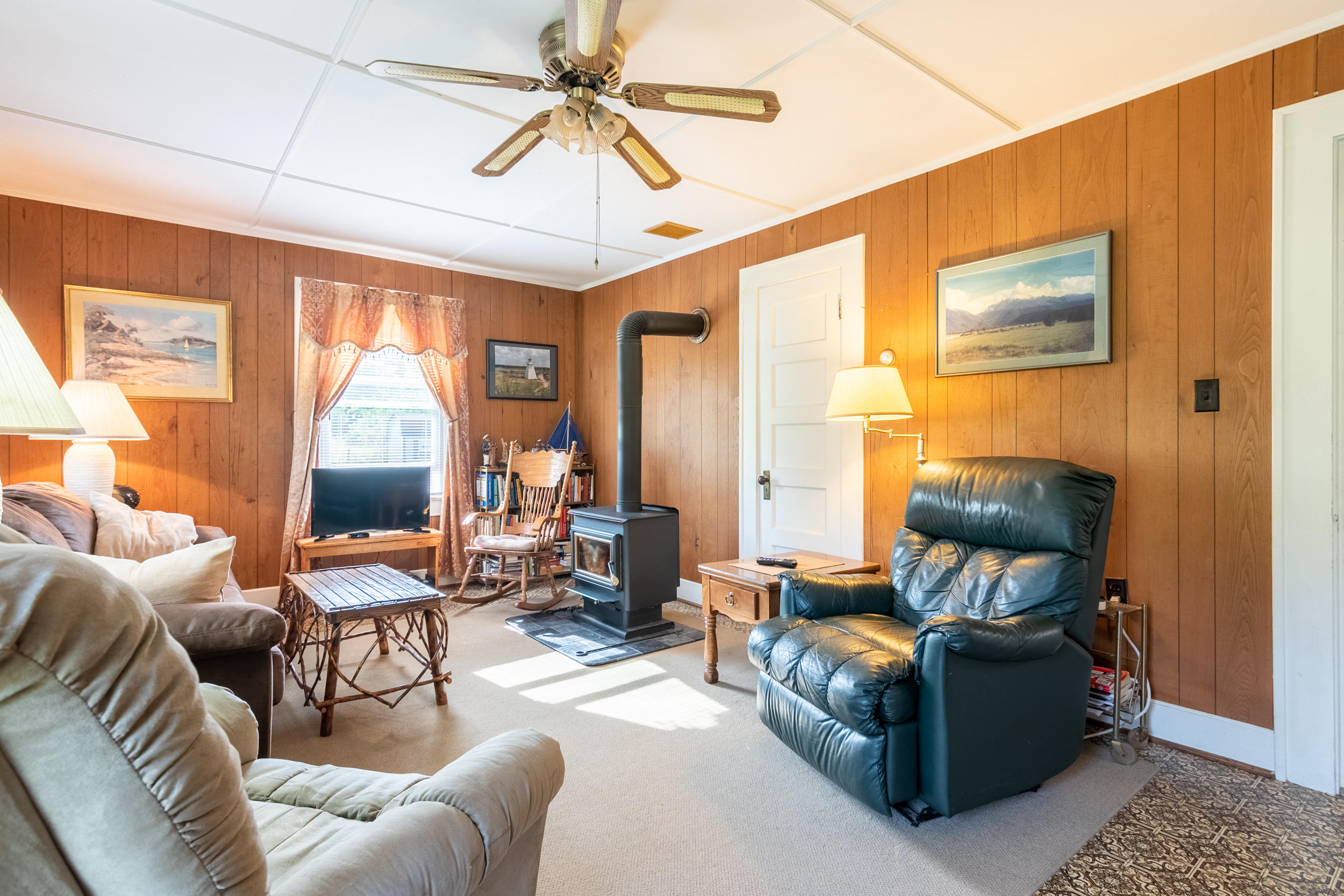856 Conner Grove Road Southwest Willis, VA 24380 - Photo 13 of 63 a living room with furniture and a chandelier