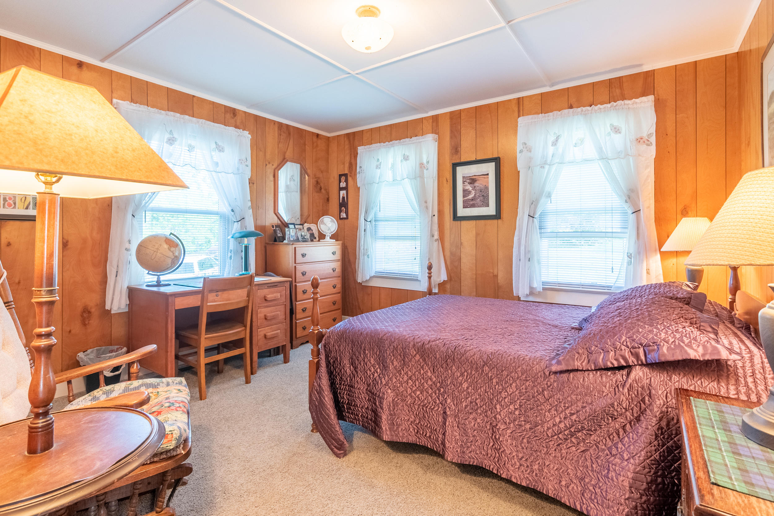856 Conner Grove Road Southwest Willis, VA 24380 - Photo 18 of 63 a bedroom with a bed and wooden cabinets