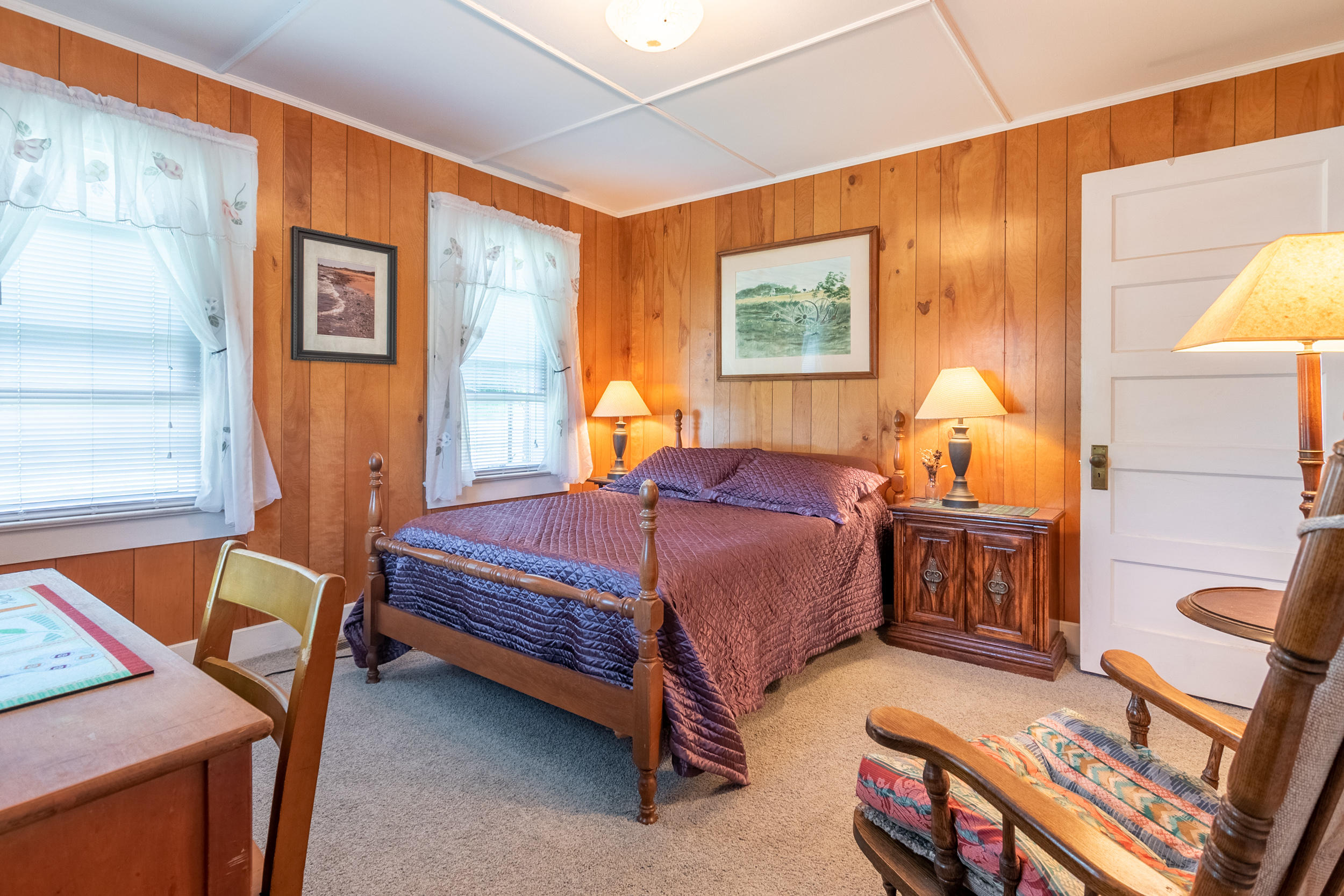 856 Conner Grove Road Southwest Willis, VA 24380 - Photo 20 of 63 a bedroom with a bed and wooden floor