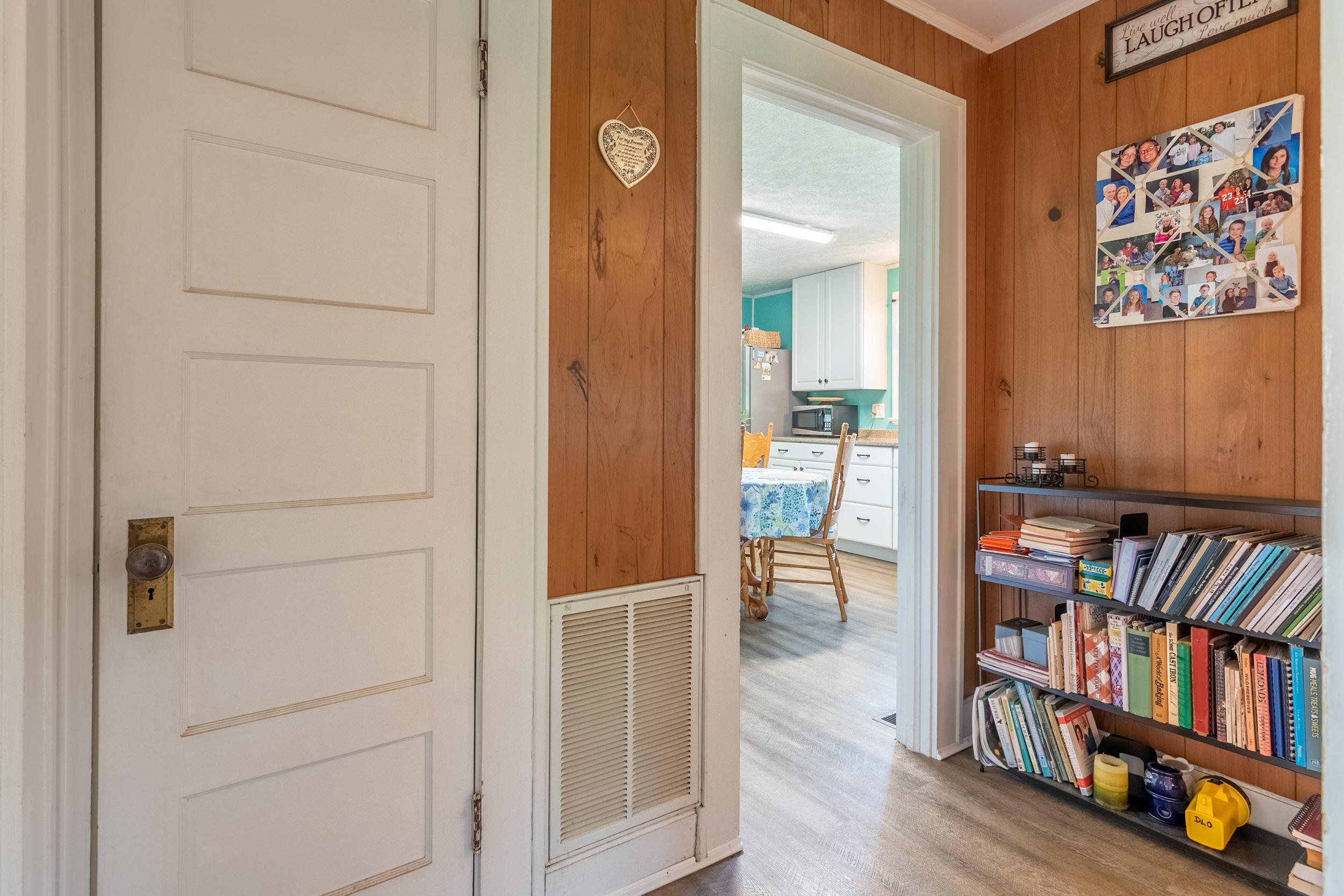 856 Conner Grove Road Southwest Willis, VA 24380 - Photo 24 of 63 a view of a hallway with wooden floor and furniture