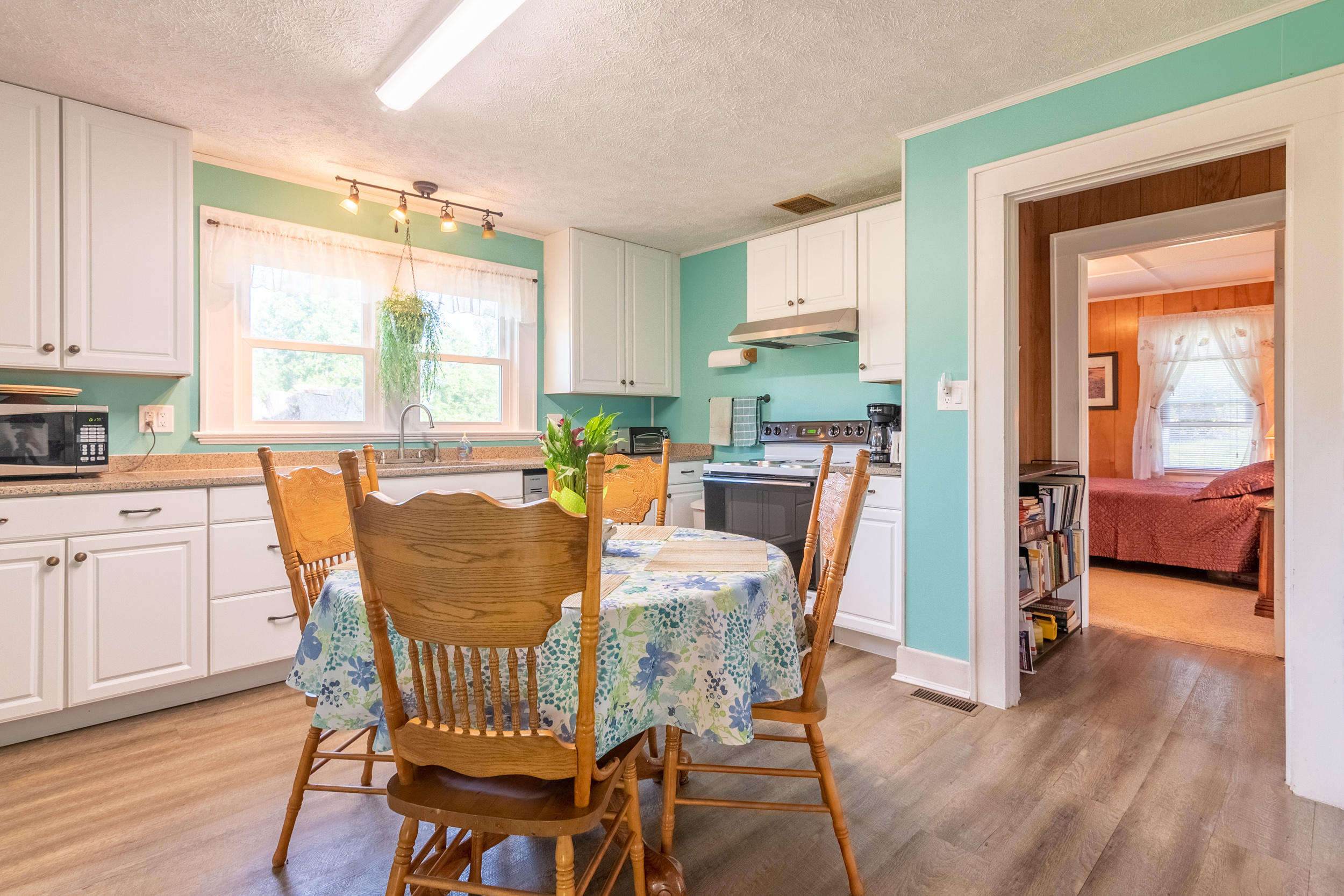 856 Conner Grove Road Southwest Willis, VA 24380 - Photo 26 of 63 a view of a dining room with furniture and a window