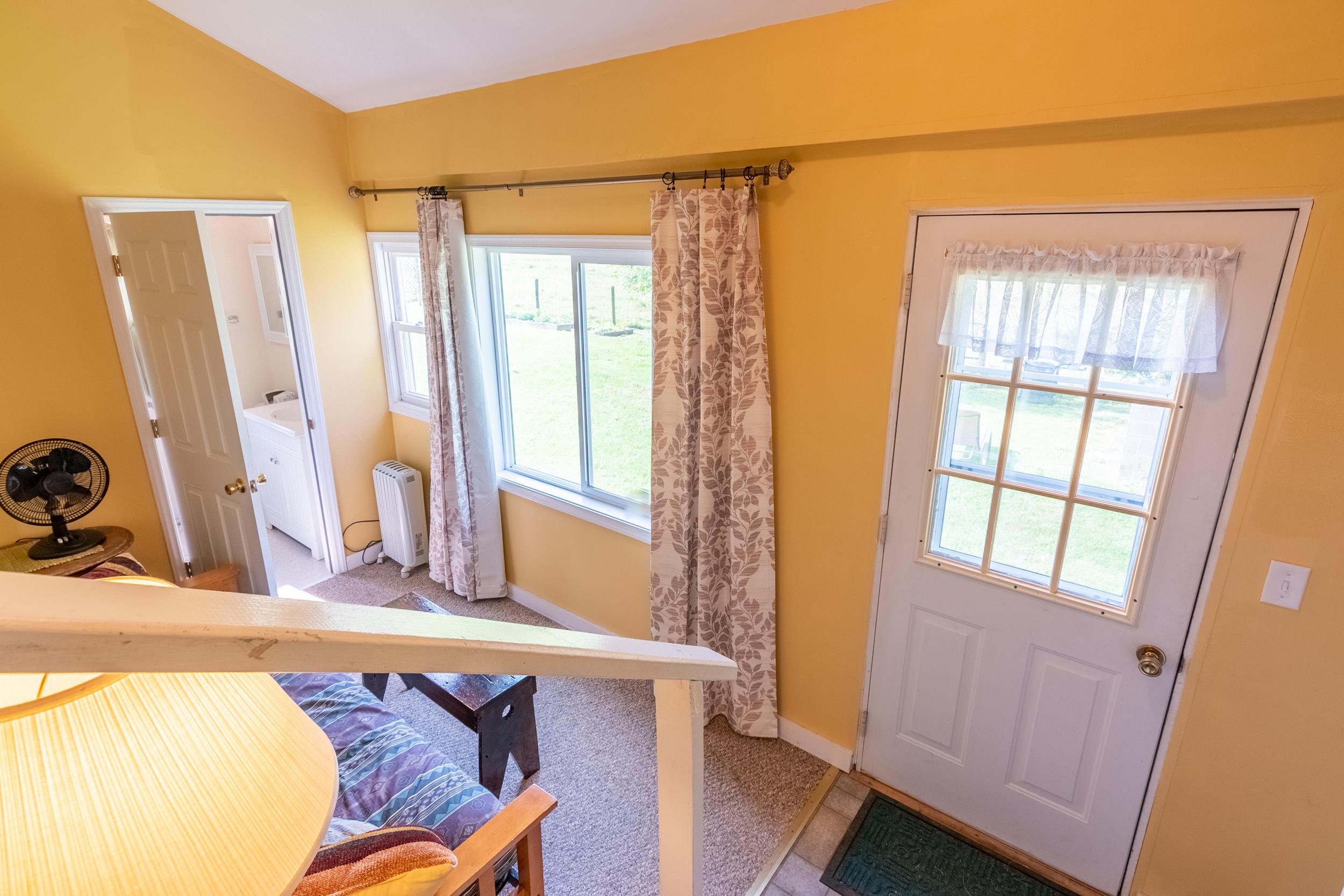 856 Conner Grove Road Southwest Willis, VA 24380 - Photo 33 of 63 a bedroom with a bed and a large window