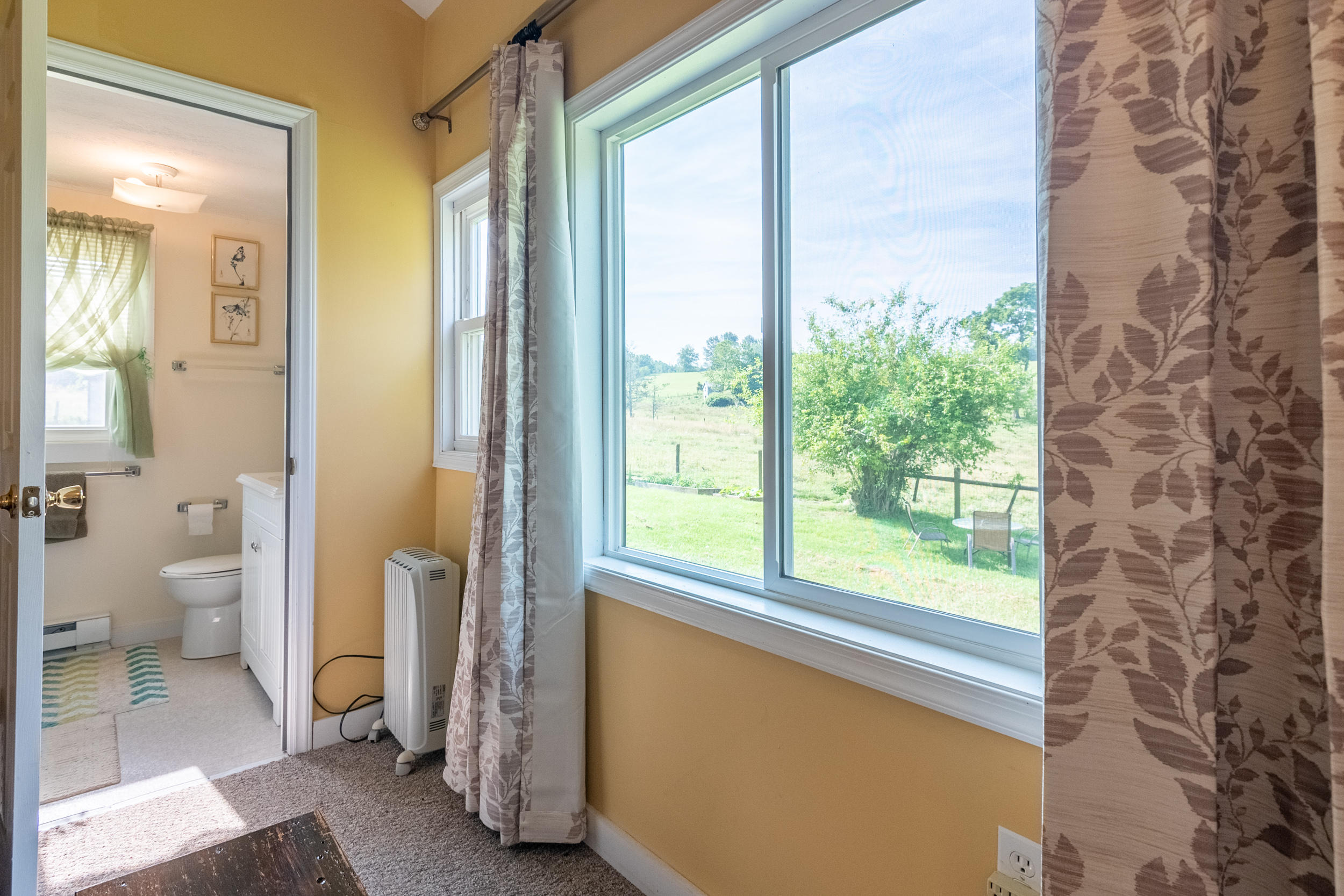 856 Conner Grove Road Southwest Willis, VA 24380 - Photo 35 of 63 a view of a bathroom with a shower and a toilet