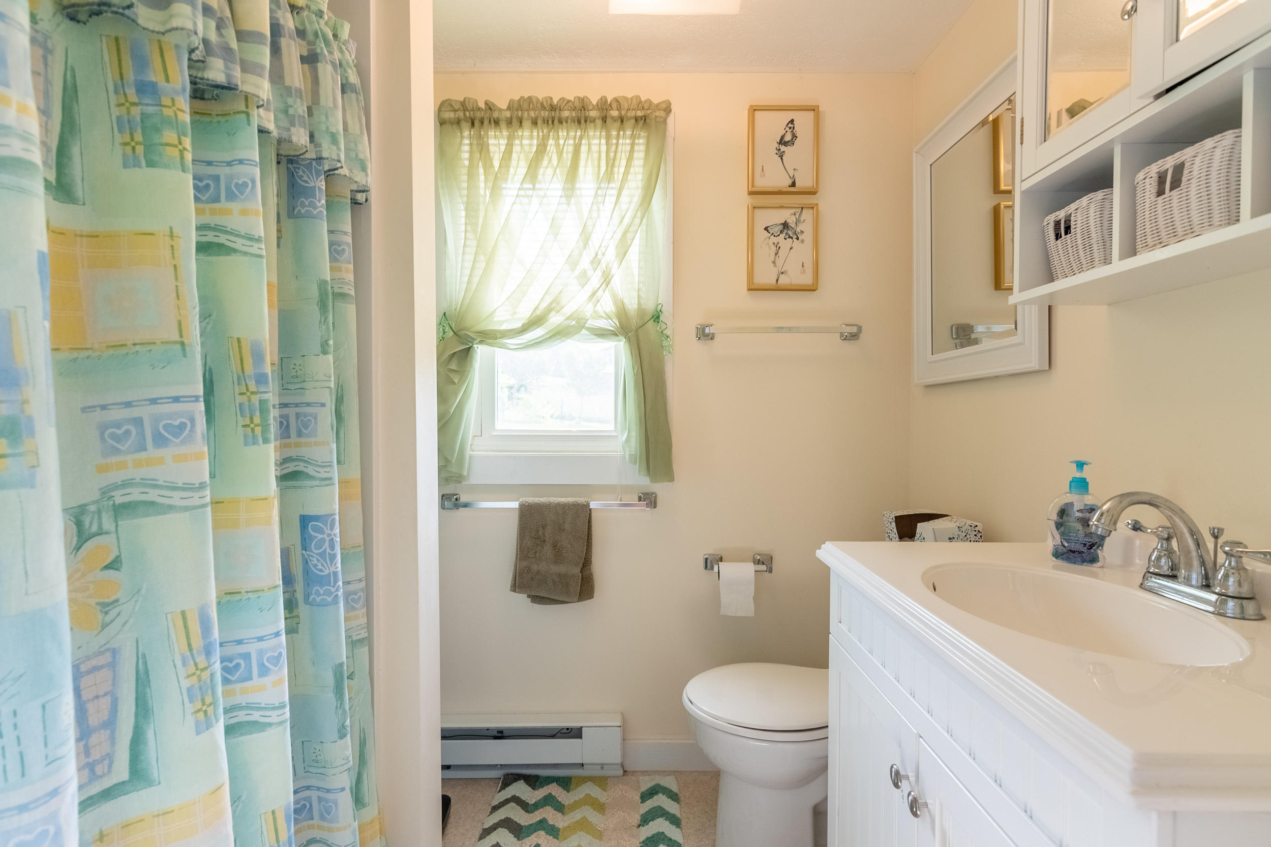 856 Conner Grove Road Southwest Willis, VA 24380 - Photo 36 of 63 a bathroom with a sink toilet and shower