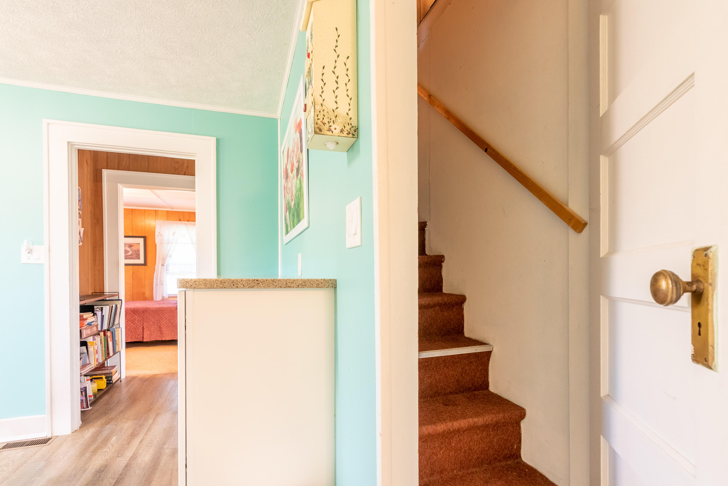 856 Conner Grove Road Southwest Willis, VA 24380 - Photo 40 of 63 a view of hallway with stairs and wooden floor