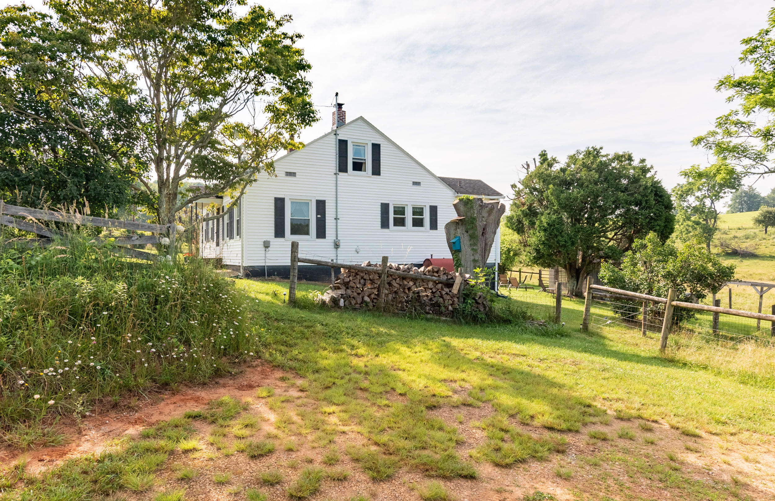 856 Conner Grove Road Southwest Willis, VA 24380 - Photo 48 of 63 a view of a house with a yard and sitting area