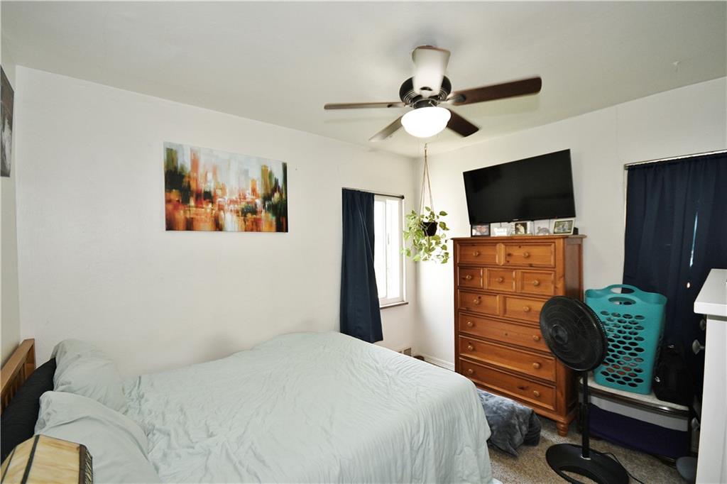 569 Loretto Road Pittsburgh, PA 15217 - Photo 13 of 18 a bedroom with a bed and a flat screen tv