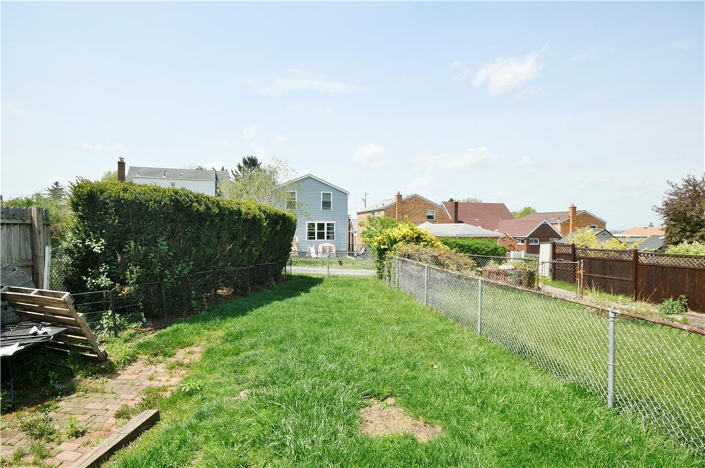 569 Loretto Road Pittsburgh, PA 15217 - Photo 18 of 18 a view of a house with a yard and a fence
