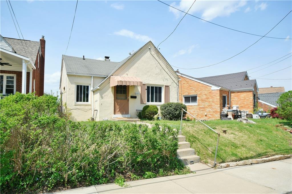 569 Loretto Road Pittsburgh, PA 15217 - Photo 2 of 18 a front view of a house with a yard