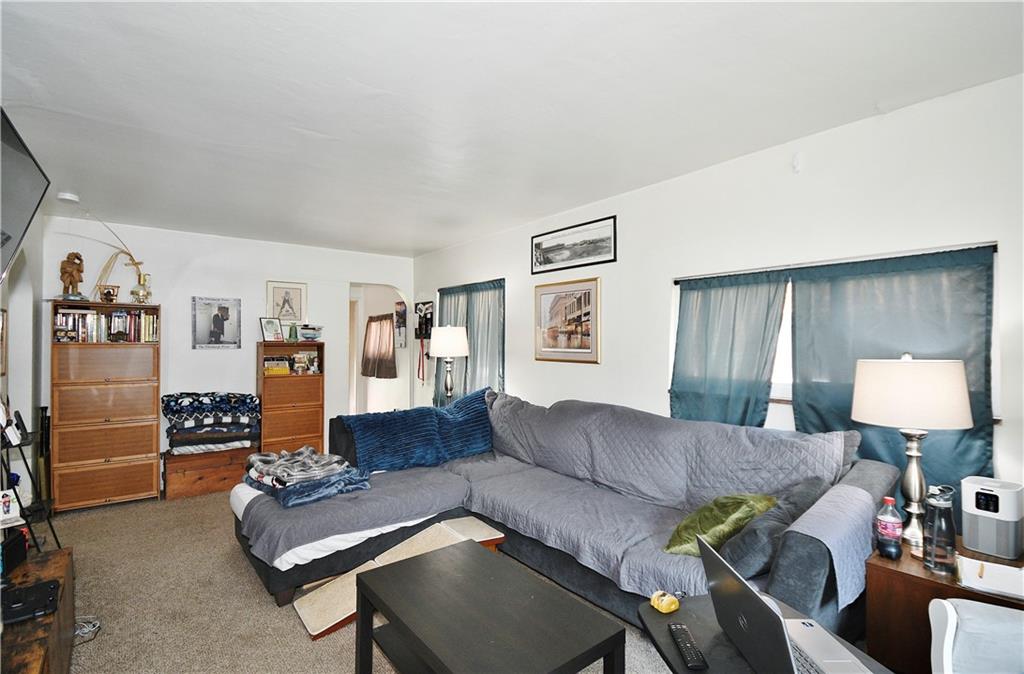 569 Loretto Road Pittsburgh, PA 15217 - Photo 4 of 18 a living room with furniture and a lamp