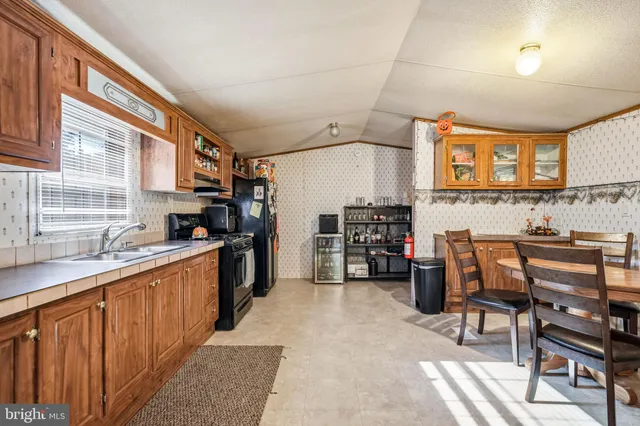 a kitchen with lots of counter top space and appliances