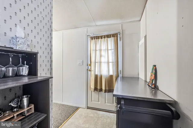 a view of workspace with furniture and window