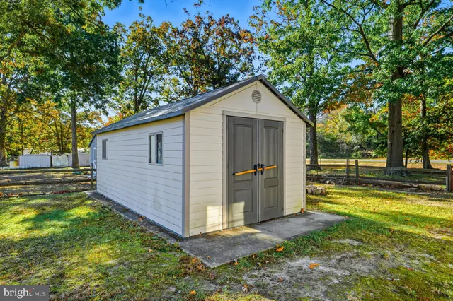 a view of a backyard with swimming pool