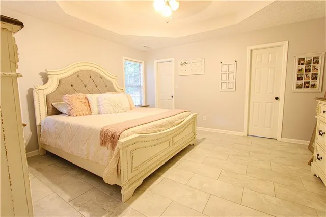 a bedroom with a bed and a cabinets