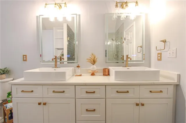 a bathroom with a shower and a sink
