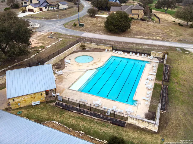 a view of house with garden and lake view